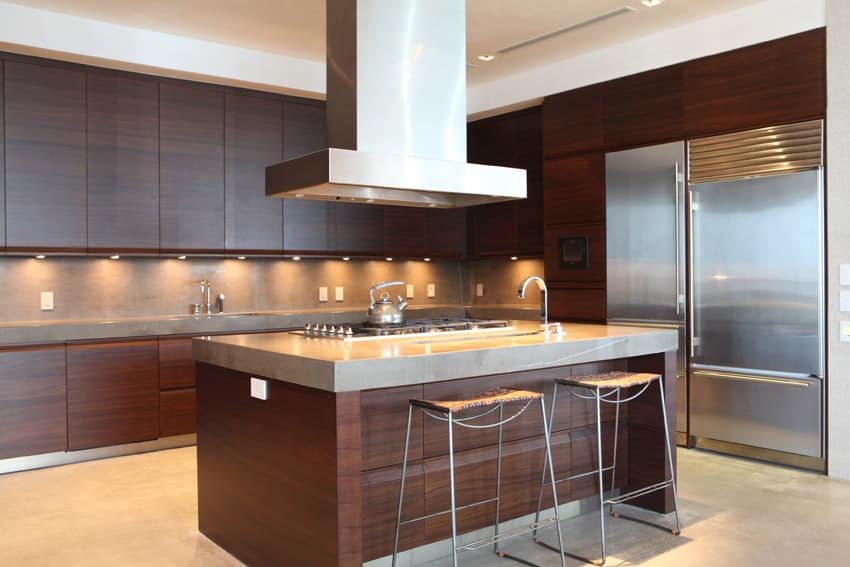 Brown modern kitchen with stainless oven hood