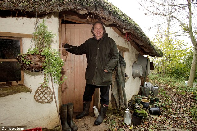 Michael Buck and the cob house he has built for just £150 without using any power tools