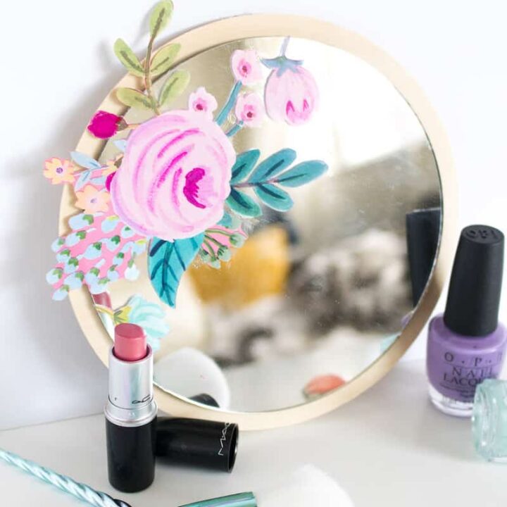 This is the easiest method ever to decorate a mirror! Add a little DIY flair with Mod Podge and your favorite wrapping paper or napkins, then finish with a wood background. Learn how here!