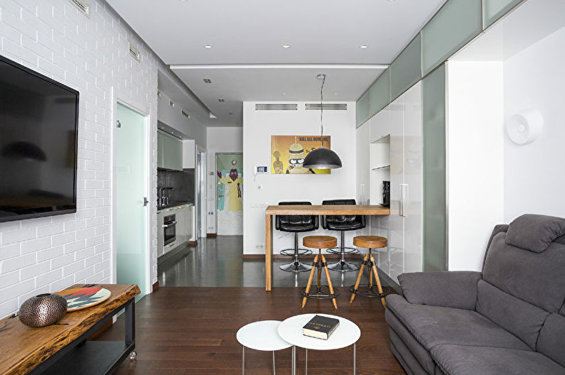 Дизайн интерьера кухни-гостиной в белом цвете - фото