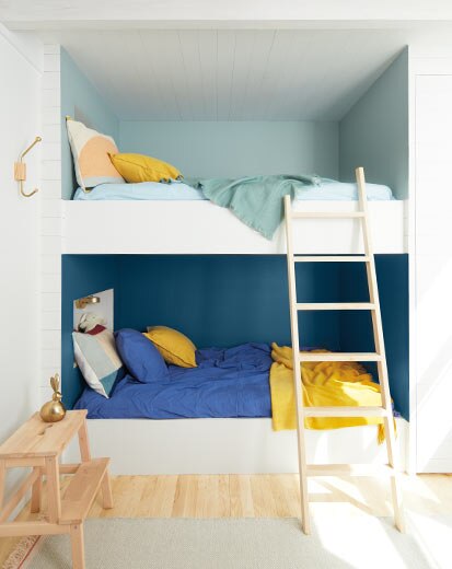 A bunk bed alcove with two-tone blue walls