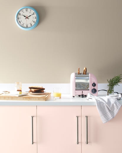 A pale kitchen with pink cabinets painted with Benjamin Moore