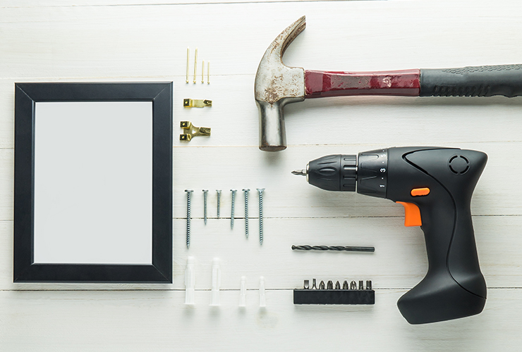 Shot of tools for hanging a picture