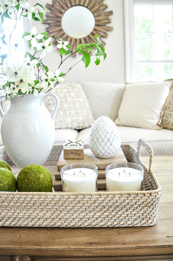 basket as a tray for a coffee table vignette